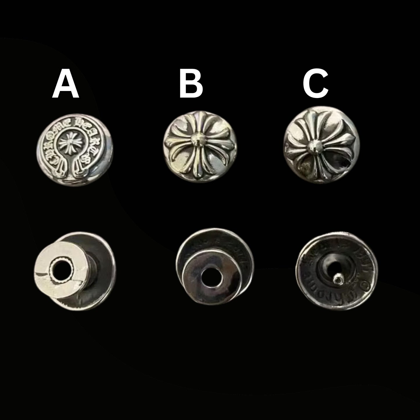 Set of six silver metal buttons with different designs on a black background